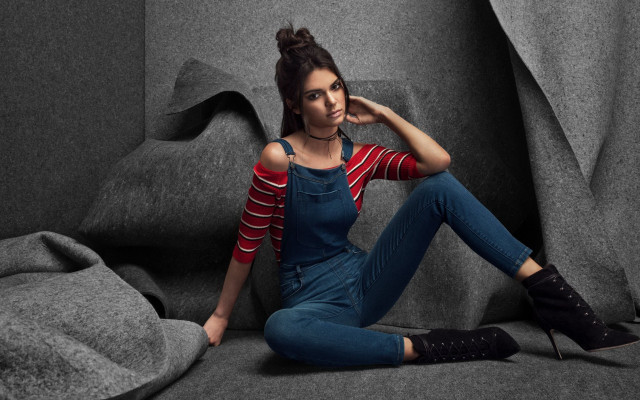 Woman sitting couch striped jeans free wallpaper for desktop - medium preview image