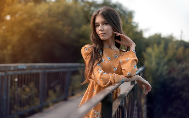 Woman leaning rail phone trees free wallpaper for desktop - medium preview image