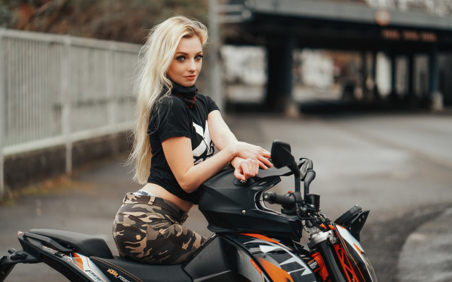 Woman motorcycle parking lot fence free wallpaper for desktop - medium preview image