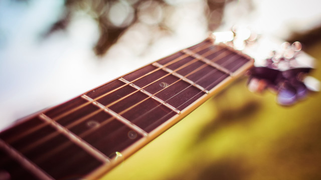 Guitar neck shallow depth blur free wallpaper for desktop - medium preview image