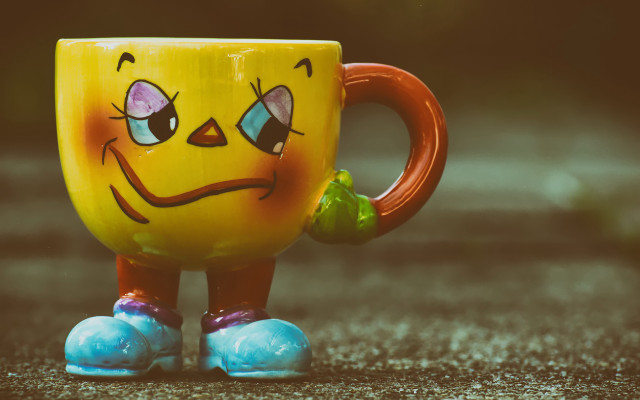 Yellow coffee cup face green free wallpaper for desktop - medium preview image