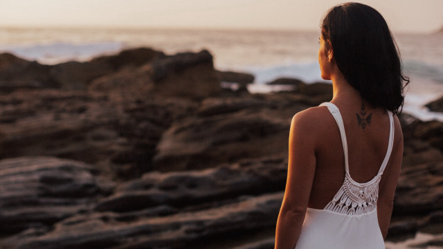Rocky beach woman tattoo backlighting free wallpaper for desktop - medium preview image