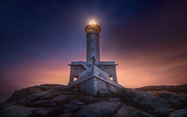 Lighthouse rocky hill bright light free wallpaper for desktop - medium preview image