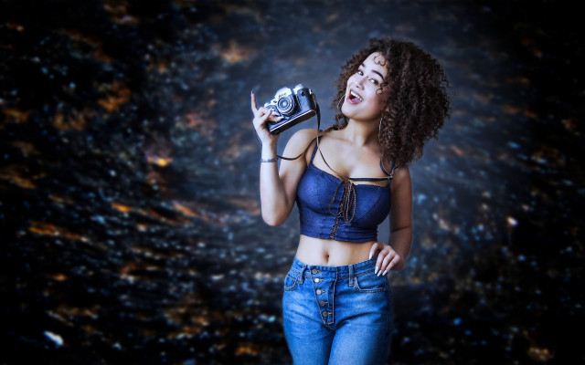 Woman camera smiling dark background free wallpaper for desktop - medium preview image