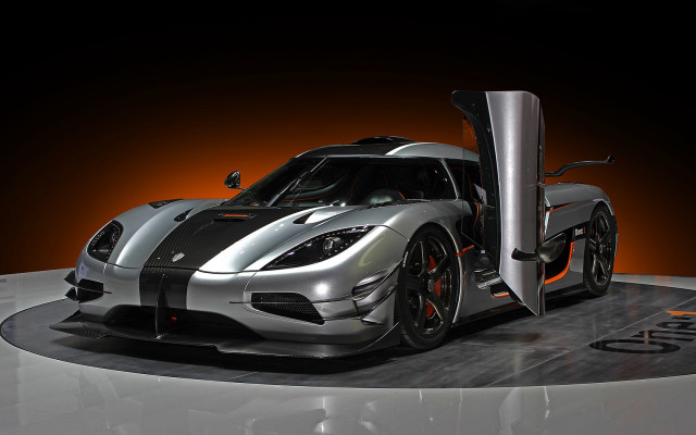 Silver black sports car showroom free wallpaper for desktop - medium preview image