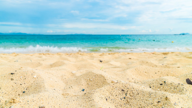 Beach ocean sand sky clouds free wallpaper for desktop - medium preview image