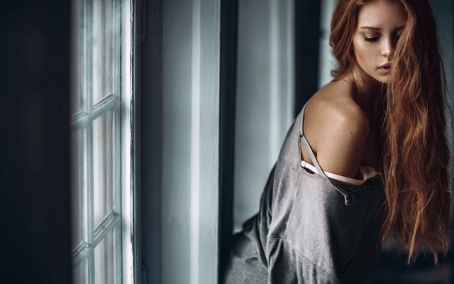 Red haired woman leaning wall free wallpaper for desktop - medium preview image