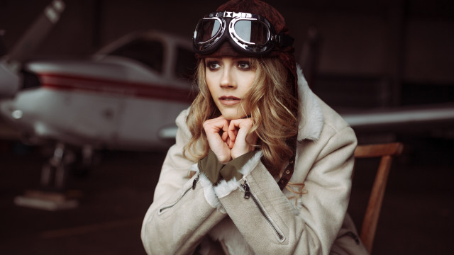 Woman goggles jacket plane hangar free wallpaper for desktop - medium preview image