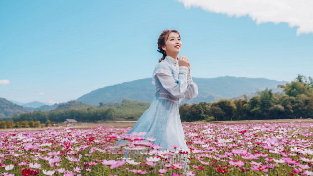 Woman flower field sky mountains free wallpaper for desktop - medium preview image