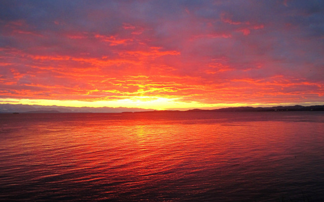 Sunset mountains water boat sky free wallpaper for desktop - medium preview image