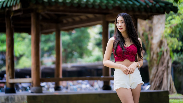 Woman red top white shorts free wallpaper for desktop - medium preview image