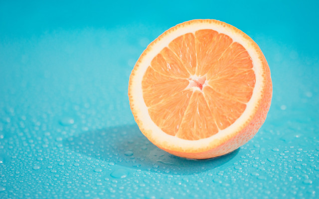 Orange slice blue water droplets free wallpaper for desktop - medium preview image