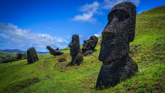 Rocky hilltop green field statue free wallpaper for desktop - medium preview image