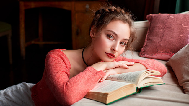 Woman lying book pinkpillow portrait free wallpaper for desktop - medium preview image