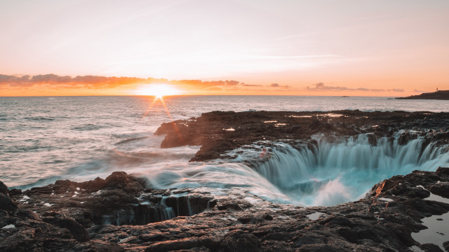 Sunset ocean rocks lake mountain free wallpaper for desktop - medium preview image