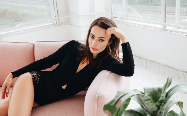 Woman black dress pink couch free wallpaper for desktop - medium preview image