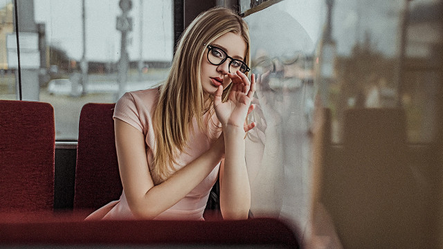 Woman sitting bus reflection glasses free wallpaper for desktop - medium preview image
