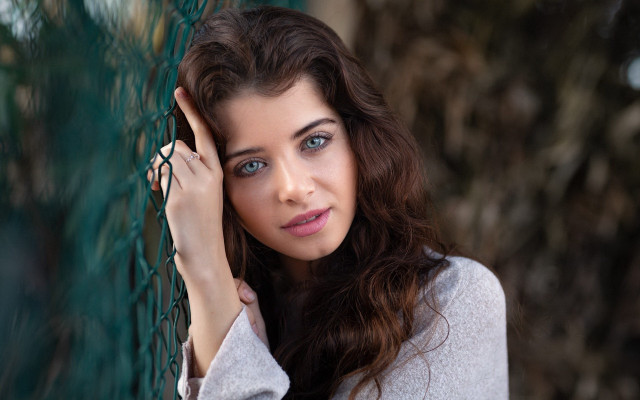 Woman fence serious blue eyes free wallpaper for desktop - medium preview image