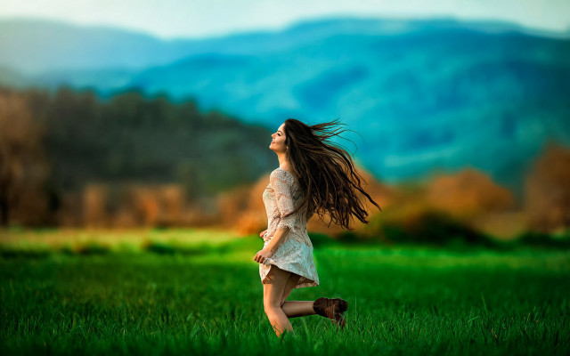 Woman field mountains wind blurry free wallpaper for desktop - medium preview image