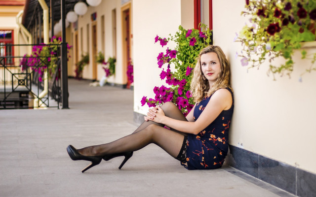 Woman sitting building flowers portrait free wallpaper for desktop - medium preview image