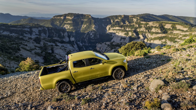 Yellow truck rocky hill mountains free wallpaper for desktop - medium preview image