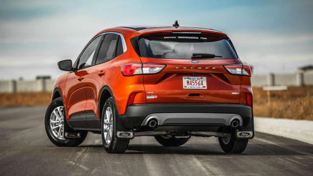 Red ford suv driving daytime free wallpaper for desktop - medium preview image