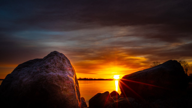 Sunset water rocks dark sky free wallpaper for desktop - medium preview image