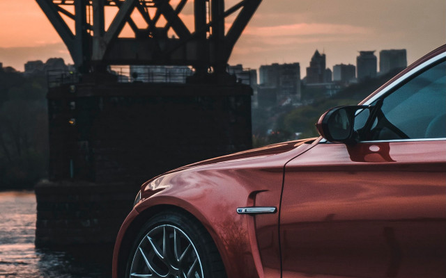 Red car bridge city sunset free wallpaper for desktop - medium preview image