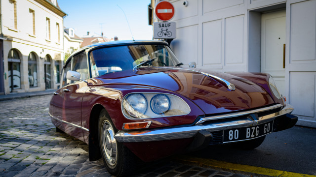 Red car parked road building free wallpaper for desktop - medium preview image