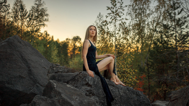 Woman sitting rock black dress free wallpaper for desktop - medium preview image