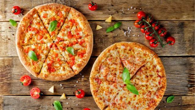Two pizzas wooden table tomatoes free wallpaper for desktop - medium preview image