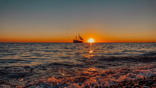 Boat ocean sunset dusk mountain free wallpaper for desktop - medium preview image