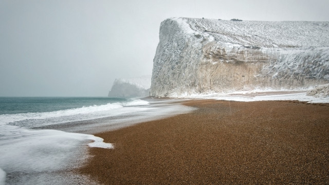 White cliff beach waves person free wallpaper for desktop - medium preview image