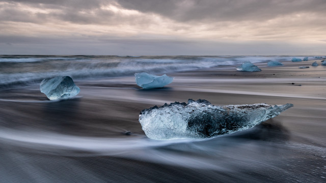 Icebergs beach ocean cloudy sky free wallpaper for desktop - medium preview image