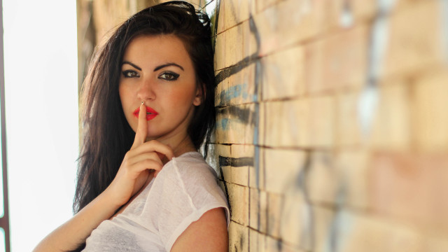 Woman red lipstick wall shushing free wallpaper for desktop - medium preview image