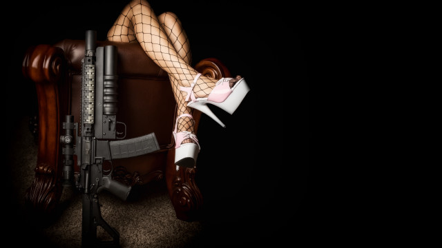 Woman fishnet stockings gun chair free wallpaper for desktop - medium preview image