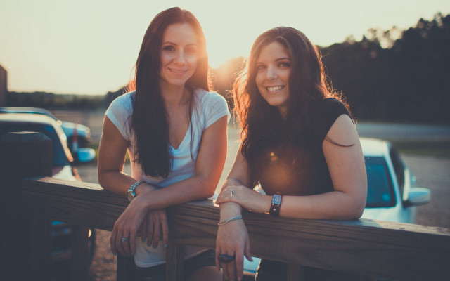 Two women bench truck sunset free wallpaper for desktop - medium preview image