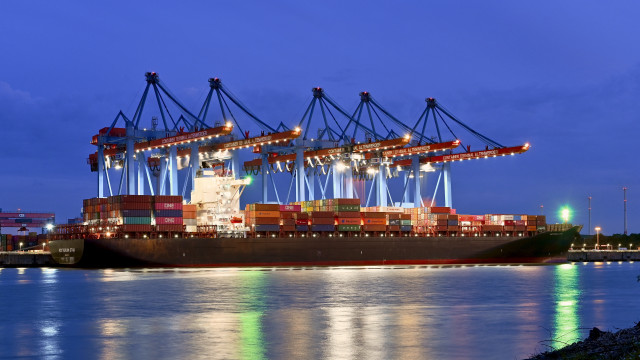 Cargo ship dock night lights free wallpaper for desktop - medium preview image