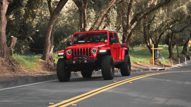 Red jeep forest road sunny free wallpaper for desktop - medium preview image