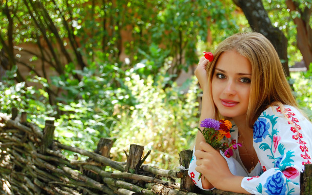 Woman fence flowers smile outdoors free wallpaper for desktop - medium preview image