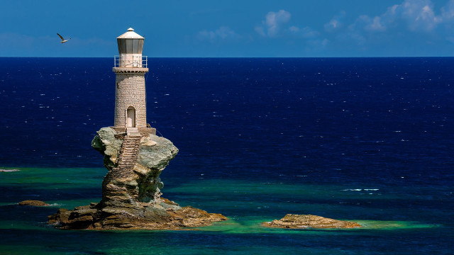 Lighthouse rock ocean bird blue free wallpaper for desktop - medium preview image