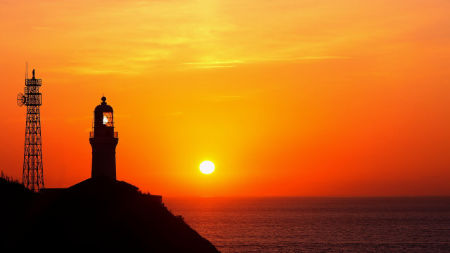 Lighthouse hill sunset moon orange free wallpaper for desktop - medium preview image