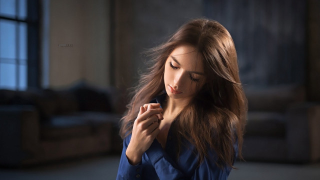 Serious woman blue coat portrait free wallpaper for desktop - medium preview image