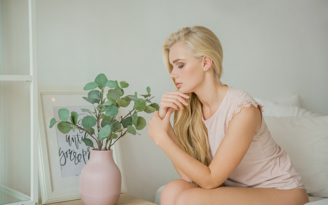 Woman sitting bed plant vase free wallpaper for desktop - medium preview image