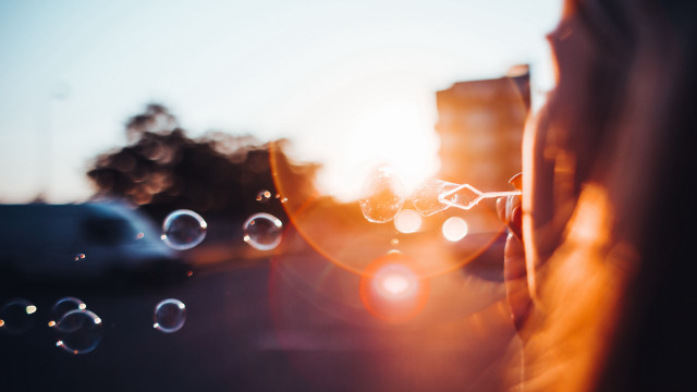 Person bubbles building sun lens free wallpaper for desktop - medium preview image
