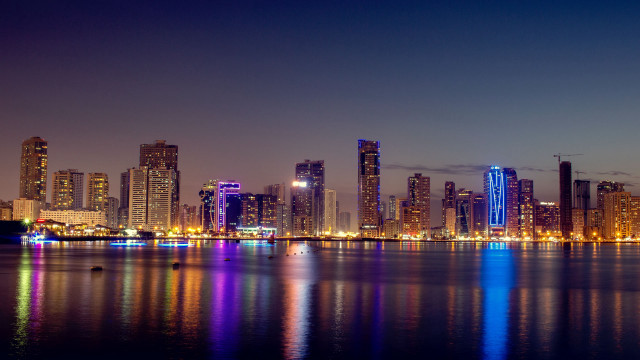 City skyline lake boat night free wallpaper for desktop - medium preview image