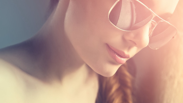 Woman glasses braid looking down free wallpaper for desktop - medium preview image