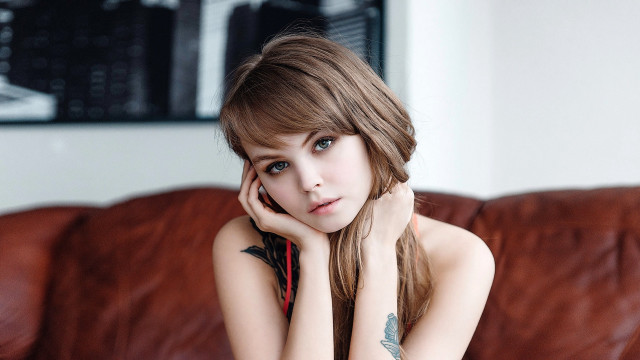 Woman couch tattoo blue eyes free wallpaper for desktop - medium preview image