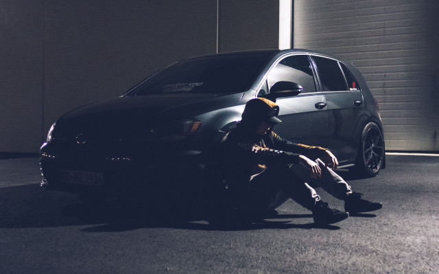 Man sitting car garage open free wallpaper for desktop - medium preview image