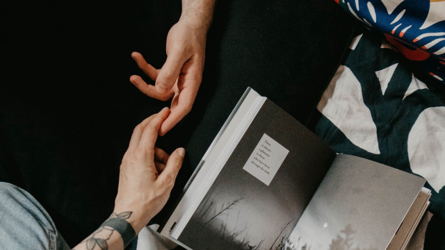 Person holding book bed blankets free wallpaper for desktop - medium preview image